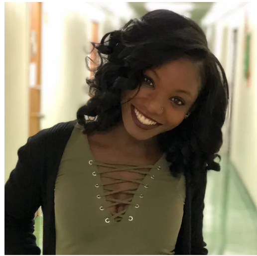 A person smiling for the cameraDescription automatically generated with medium confidence